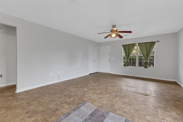 unfurnished room featuring ceiling fan