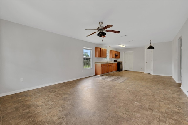 unfurnished living room with ceiling fan