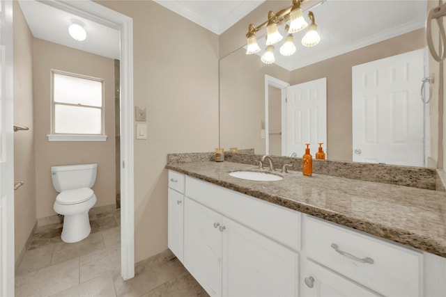 bathroom featuring tile patterned floors, crown molding, vanity, and toilet