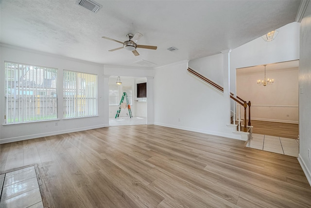 unfurnished living room featuring a textured ceiling, light hardwood / wood-style floors, and ceiling fan with notable chandelier