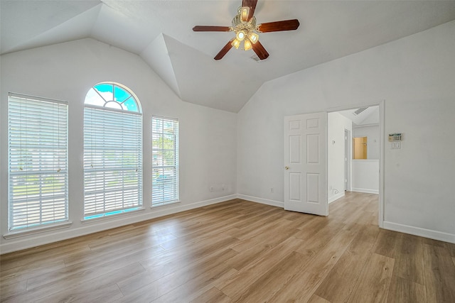 unfurnished room featuring ceiling fan, light hardwood / wood-style floors, and vaulted ceiling