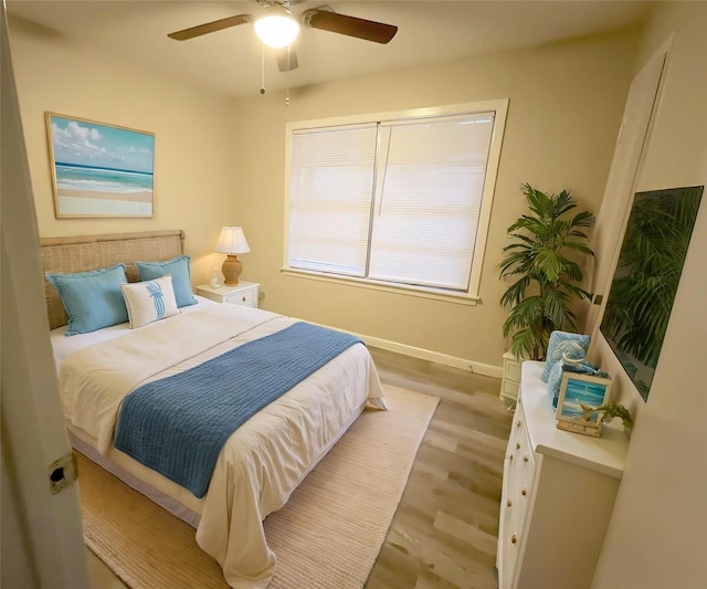 bedroom featuring ceiling fan and light hardwood / wood-style floors