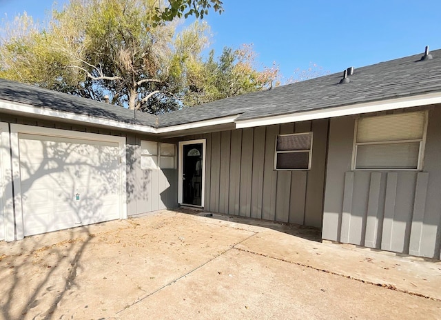 doorway to property featuring a garage