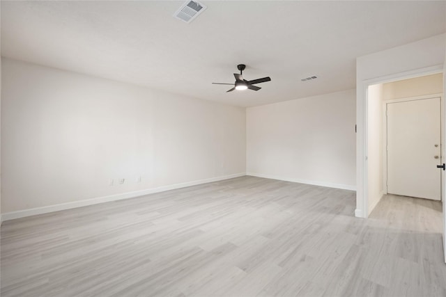 spare room featuring ceiling fan and light wood-type flooring