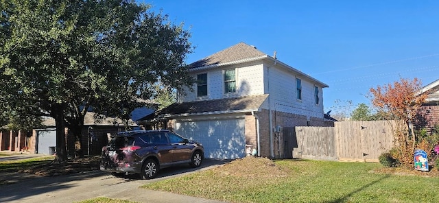 view of front property with a garage and a front lawn