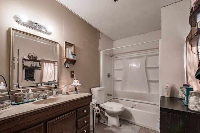 full bathroom featuring tile patterned floors, bathing tub / shower combination, a textured ceiling, toilet, and vanity