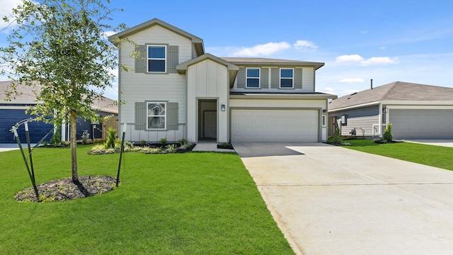 view of front of house featuring a front yard and a garage