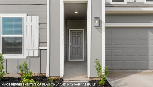 entrance to property featuring a garage