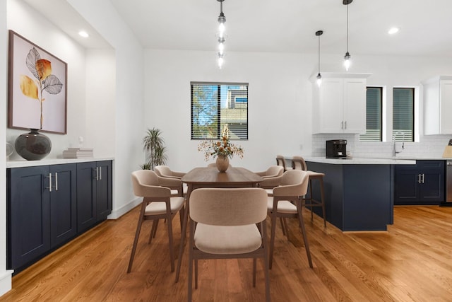 dining room featuring light hardwood / wood-style floors and sink