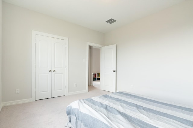 carpeted bedroom with a closet