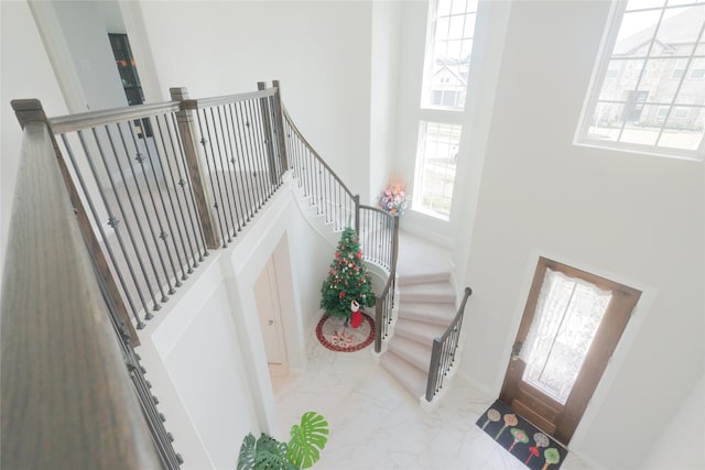 entryway with a towering ceiling