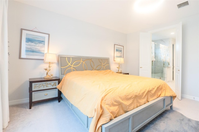 bedroom featuring carpet floors and connected bathroom