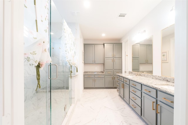 bathroom with vanity and an enclosed shower