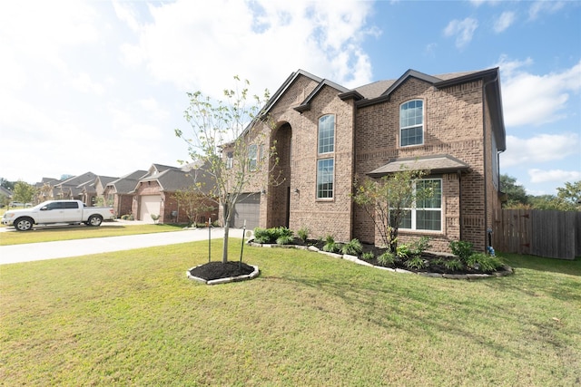 front of property featuring a front yard and a garage