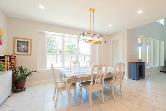 dining area with a notable chandelier