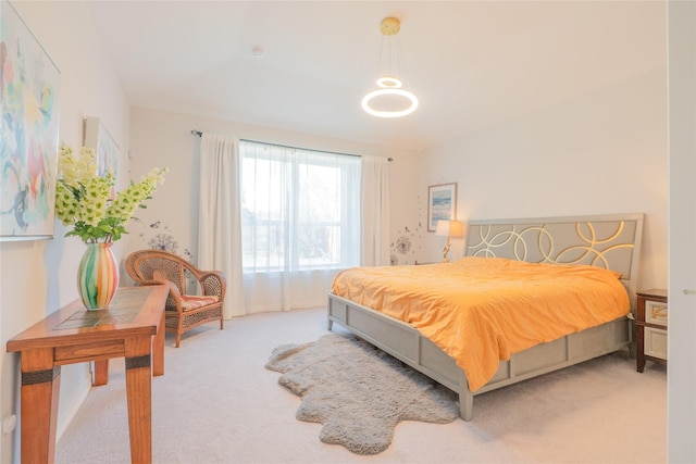 bedroom featuring light carpet