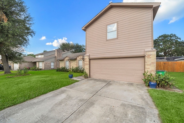 view of front of home with a garage and a front lawn