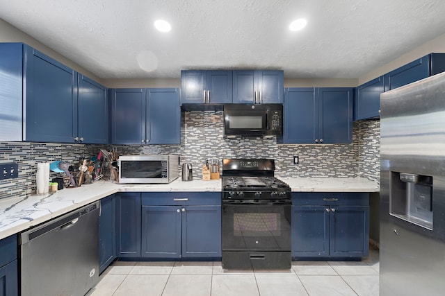 kitchen featuring black appliances, blue cabinets, decorative backsplash, light tile patterned floors, and light stone counters