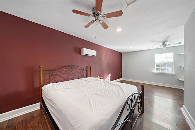 bedroom featuring a wall unit AC, ceiling fan, and dark hardwood / wood-style flooring