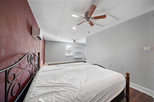 bedroom featuring an AC wall unit, ceiling fan, and dark wood-type flooring