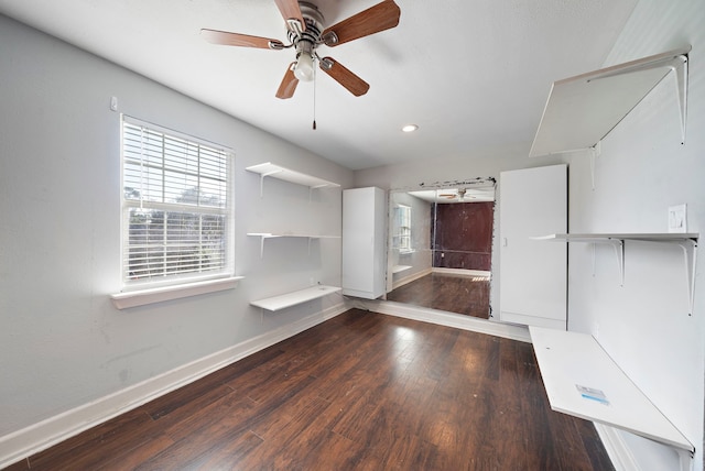 interior space featuring dark hardwood / wood-style floors and ceiling fan