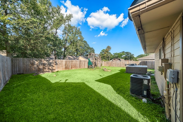 view of yard featuring central AC unit