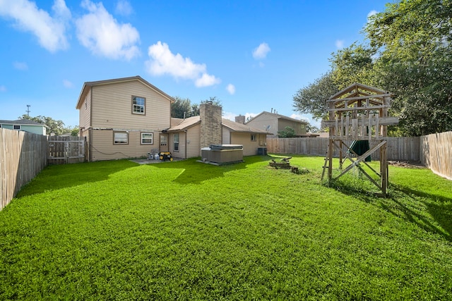 back of property featuring a yard