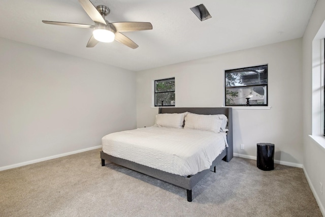 bedroom featuring light carpet and ceiling fan