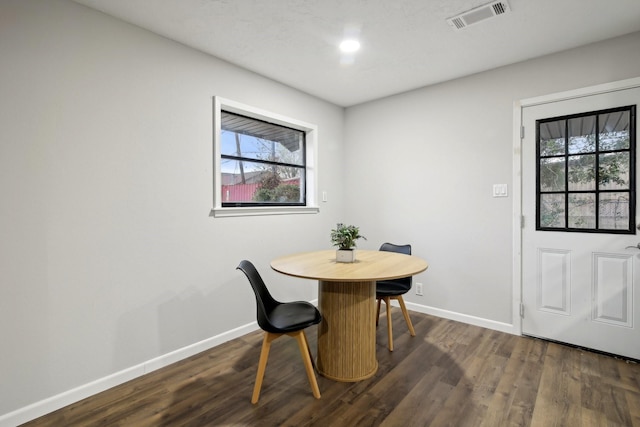 dining area featuring dark hardwood / wood-style floors