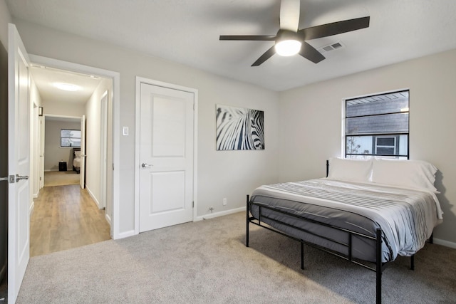 carpeted bedroom featuring ceiling fan