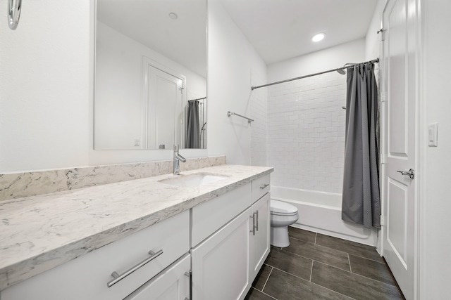 full bathroom featuring tile patterned floors, vanity, shower / bath combination with curtain, and toilet