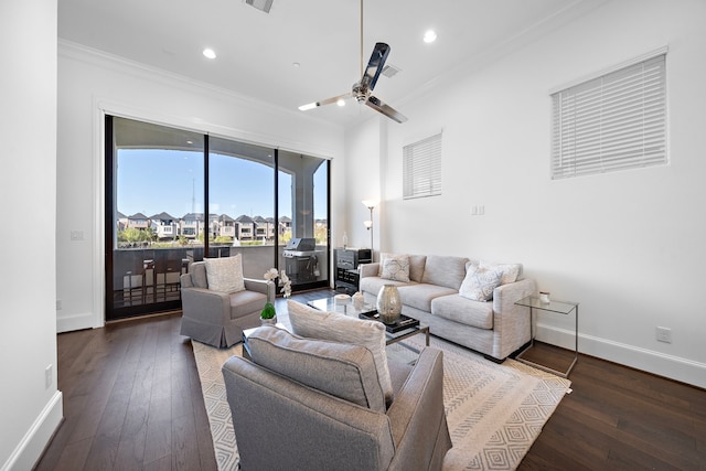 living room featuring crown molding, dark hardwood / wood-style flooring, and ceiling fan