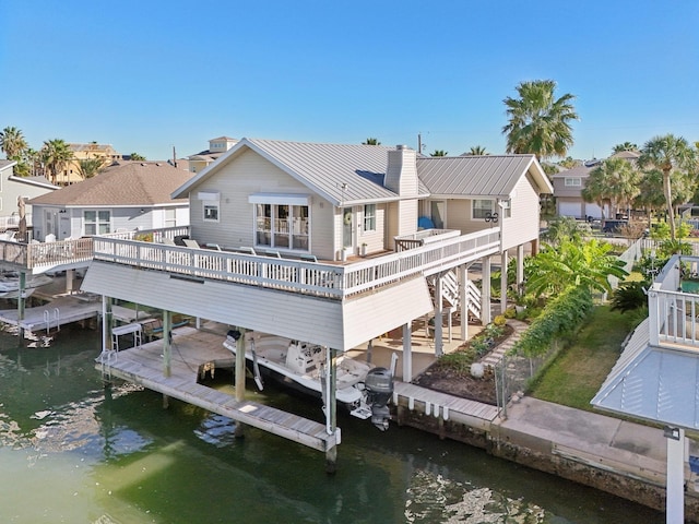 dock area featuring a deck with water view