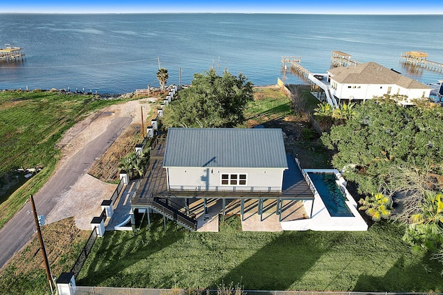 birds eye view of property with a water view