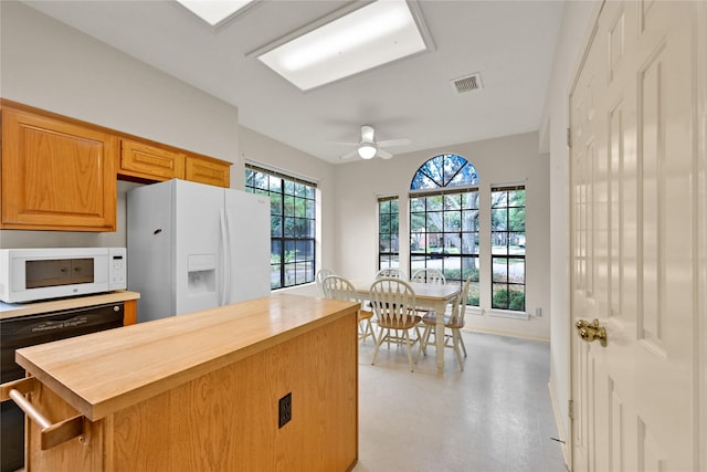 kitchen featuring wood counters, white appliances, and ceiling fan