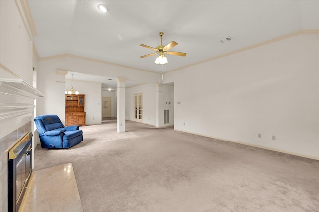 7810 Timberline Run Ln, Houston, TX 77095 - unfurnished living room featuring a tile fireplace, ornamental molding, light colored carpet, a ceiling fan, and decorative columns