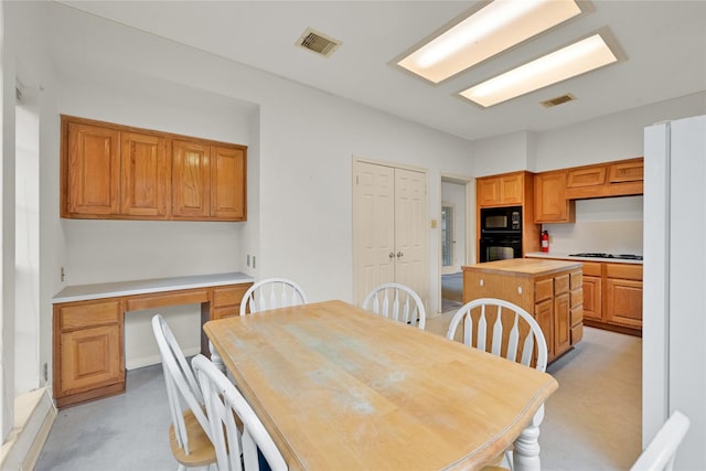 7810 Timberline Run Ln, Houston, TX 77095 - dining area with light colored carpet and built in desk