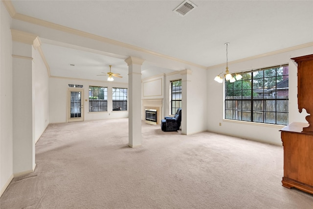 7810 Timberline Run Ln, Houston, TX 77095 - unfurnished living room featuring carpet flooring, a glass covered fireplace, crown molding, healthy amount of natural light, and a ceiling fan