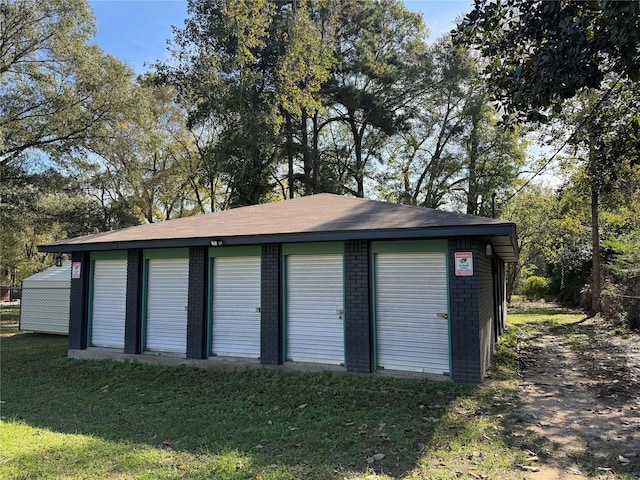 garage featuring a yard