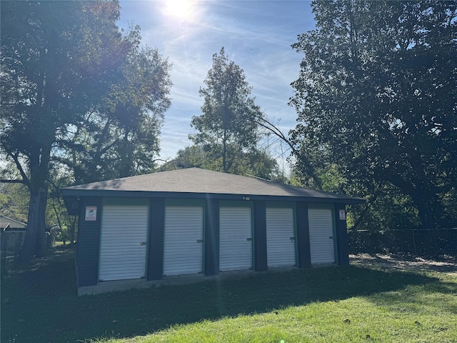 garage with a lawn