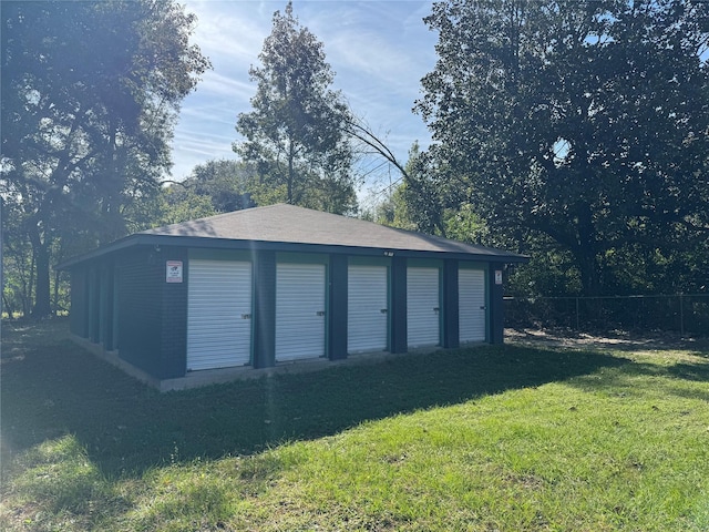 garage featuring a lawn