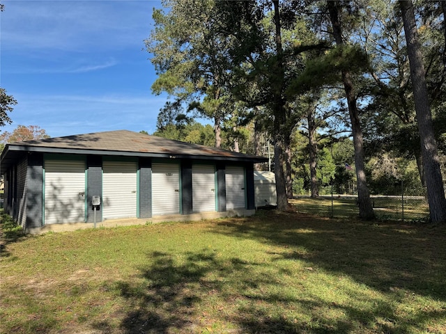 garage featuring a yard