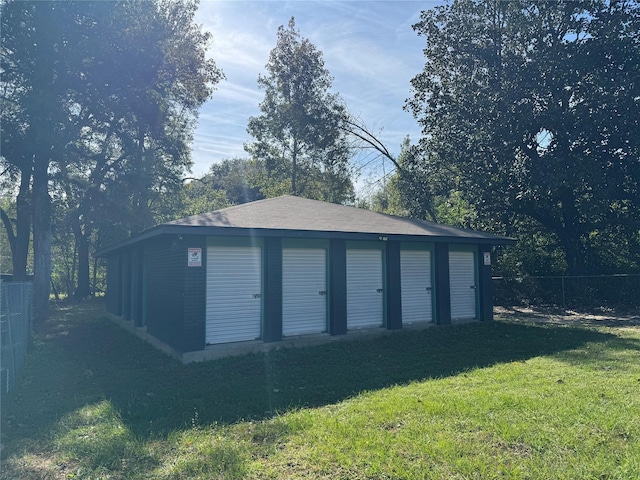 garage with a lawn