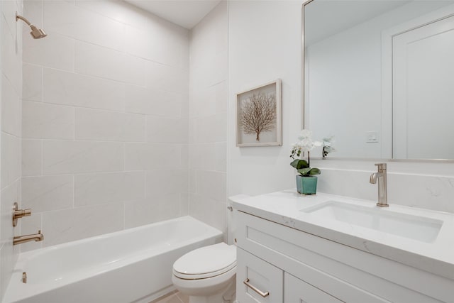 full bathroom with vanity, toilet, and tiled shower / bath