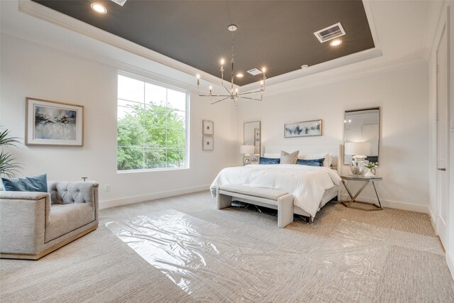 bedroom featuring a raised ceiling, light colored carpet, ornamental molding, and a chandelier