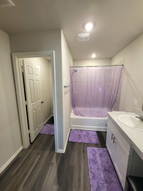 bathroom with vanity, shower / bath combo, and hardwood / wood-style flooring