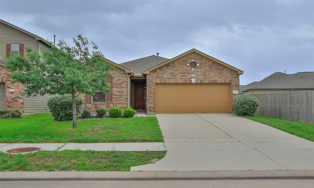 view of front of property featuring a front lawn and a garage