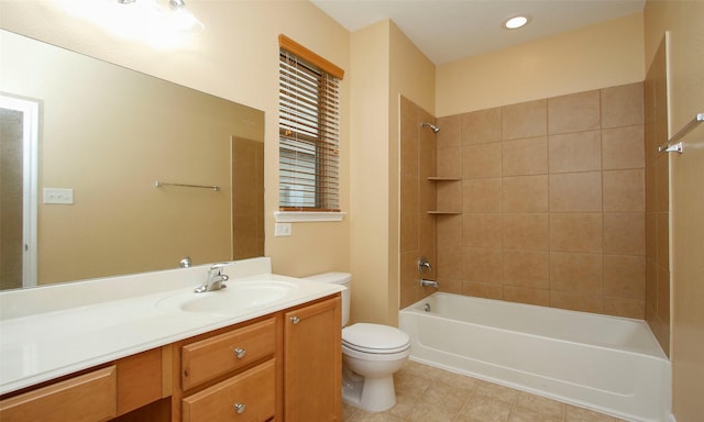 full bathroom featuring tile patterned floors, tiled shower / bath combo, toilet, and vanity