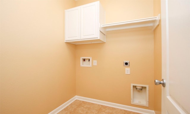 washroom with electric dryer hookup, cabinets, and washer hookup