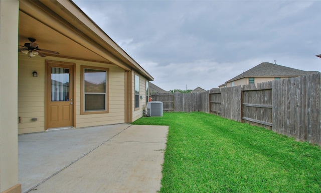 view of yard featuring a patio, cooling unit, and ceiling fan